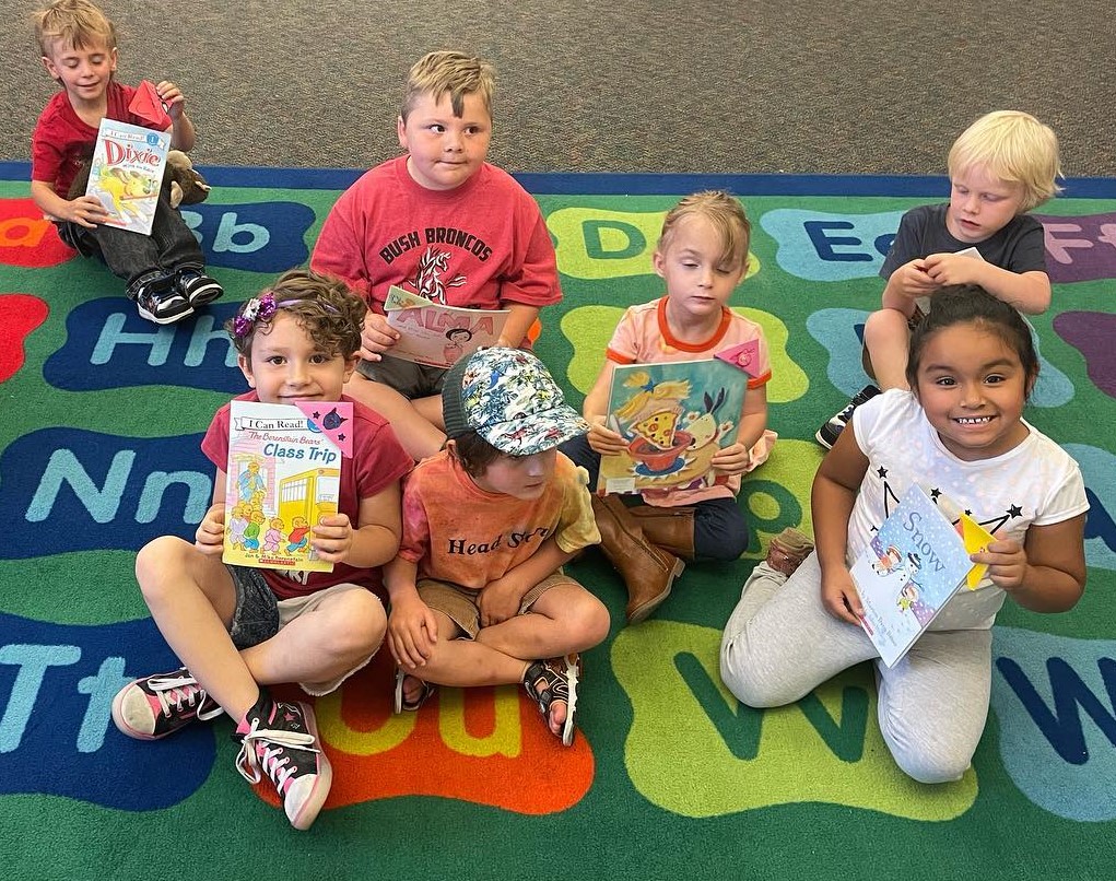 kindergarten bootcamp students with new books